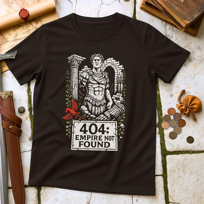 Black t-shirt with Roman emperor graphic and '404 Empire Not Found' text on a stone surface with coins and a belt.