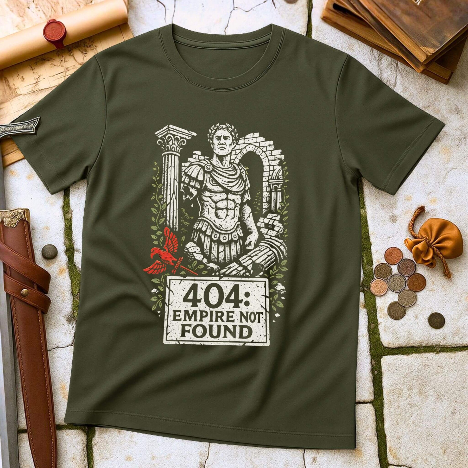Green t-shirt with Roman emperor graphic and '404 Empire Not Found' text on a stone surface with coins and a belt.