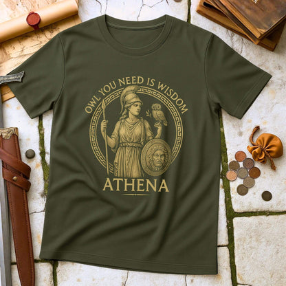 Military Green t-shirt with Athena graphic and text on a stone surface with coins and scrolls.