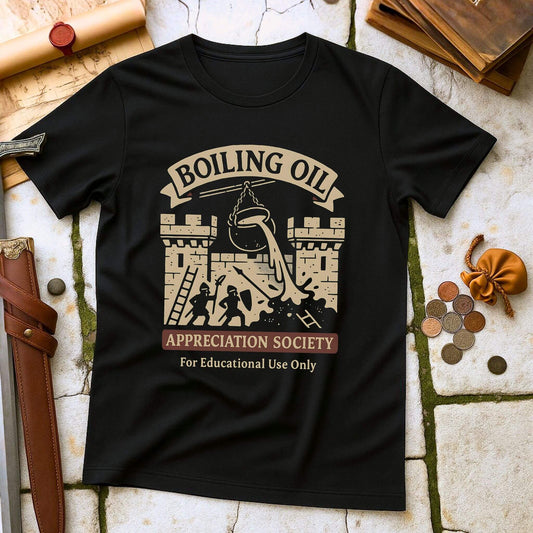 Black t-shirt with 'Boiling Oil Appreciation Society' graphic on a stone surface with historical props.