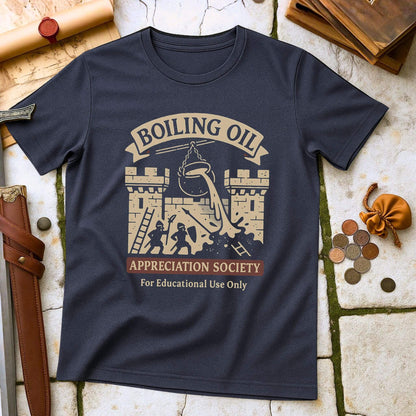 Heather Navy t-shirt with 'Boiling Oil Appreciation Society' graphic on a stone surface with historical props.