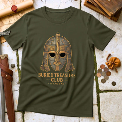 Military Green t-shirt with a Sutton Hoo helmet  graphic and 'Buried Treasure Club EST.625 AD' text on a stone surface