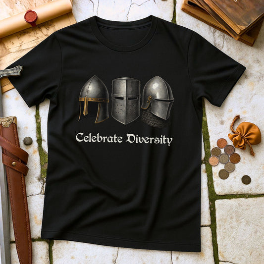Black t-shirt with three helmets and 'Celebrate Diversity' text on a stone surface with medieval-themed items.
