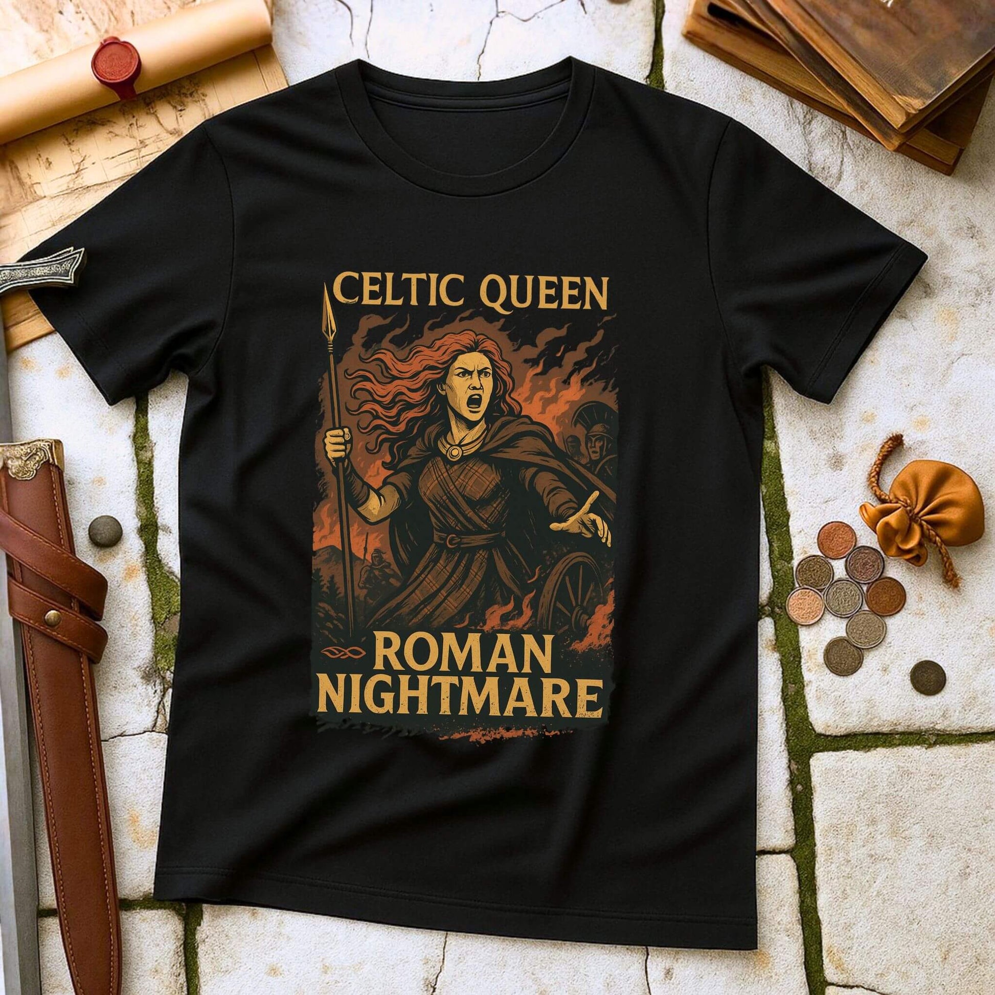 Black t-shirt with 'Celtic Queen, Roman Nightmare' design on a stone surface with historical props.