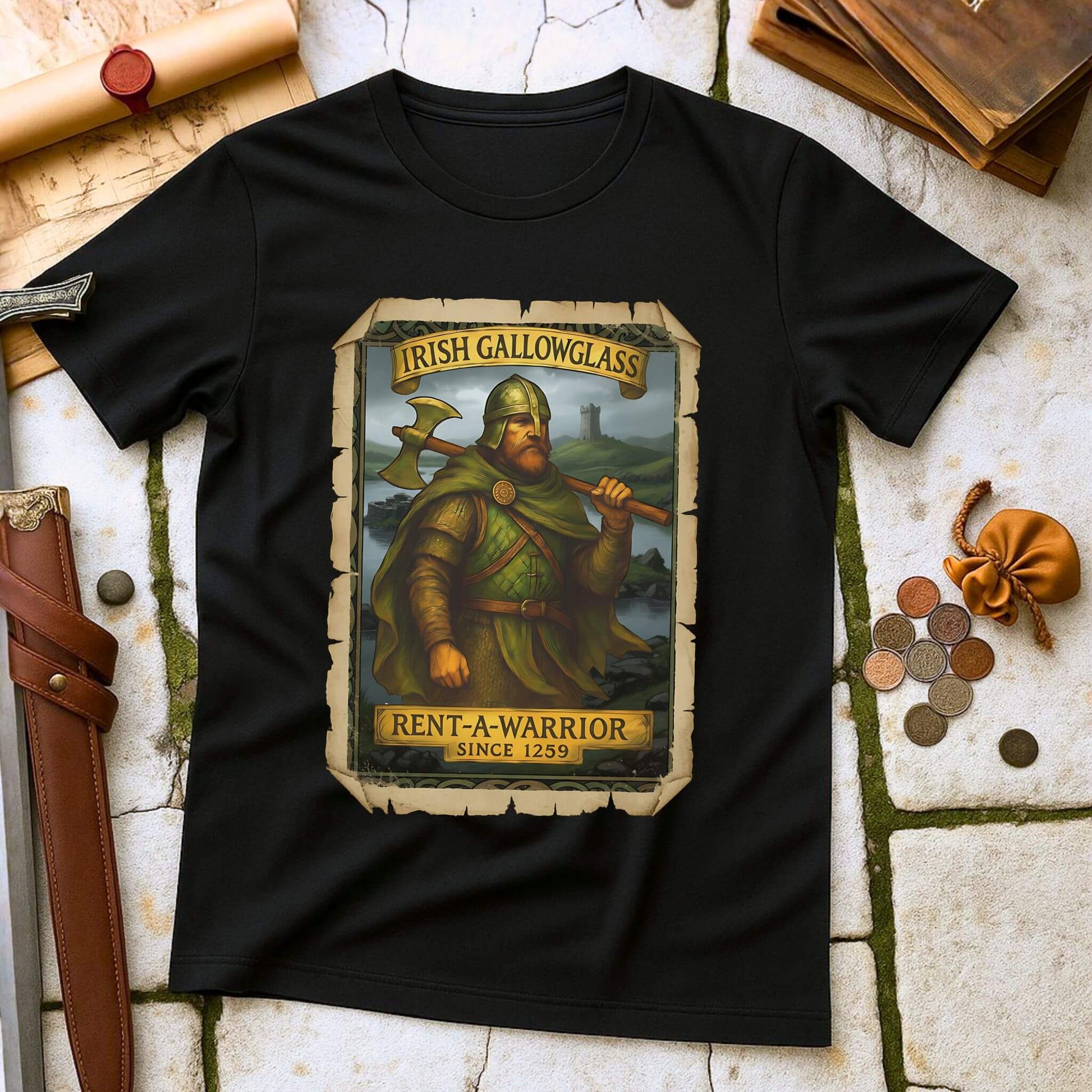 Black t-shirt with a graphic of a Irish Gallowglass warrior and text on a stone surface with historical props.