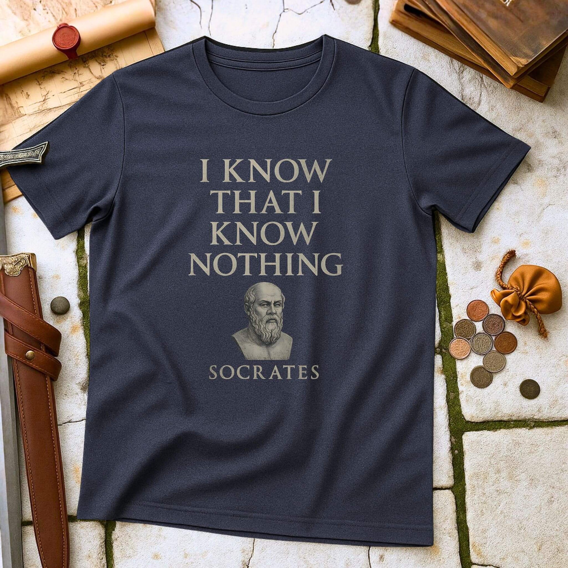 Heather Navy t-shirt with 'I Know That I Know Nothing' Socrates quote on a textured surface with classical items.