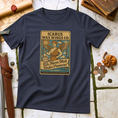 Heather Navy blue t-shirt with 'Icarus Wax Wings Co.' graphic on a textured surface with vintage items.