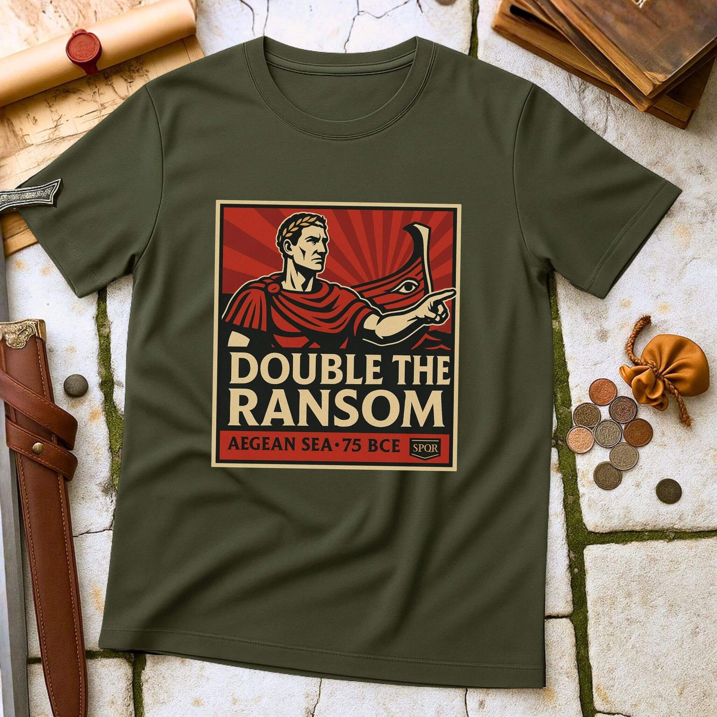 Miltiary Green t-shirt with 'Double the Ransom' graphic design on a textured surface with coins and a sword.