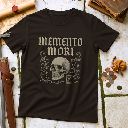Black t-shirt with 'memento mori' design featuring a skull and hourglass on a textured surface.