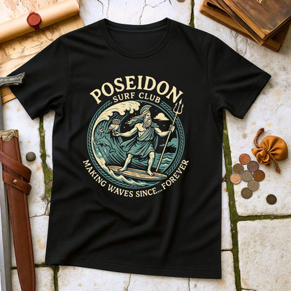 Black t-shirt with Poseidon Surf Club design on a textured surface with coins and a belt.