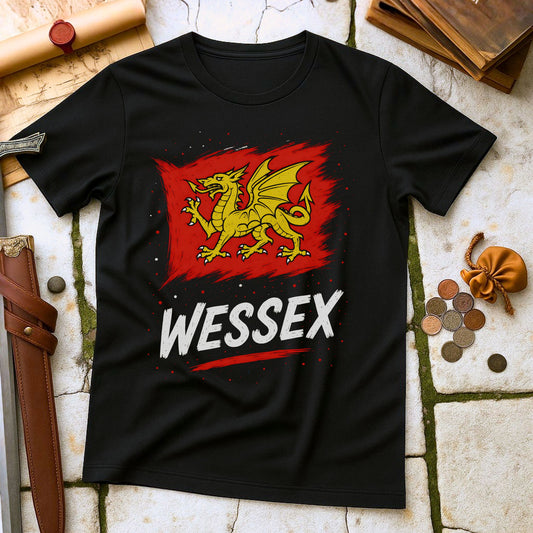 Black t-shirt with red dragon graphic and 'Wessex' text on a stone surface with coins and a belt.