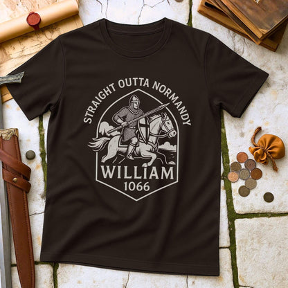 Dark Chocolate t-shirt with a graphic design of a knight with printed text that says " Straight outta Normandy WIlliam 1066"  on a stone surface with historical props.