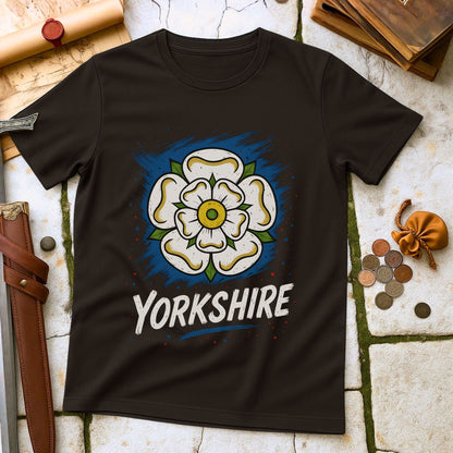 Dark Chocolate t-shirt with a Yorkshire rose design on a stone surface with historical items.